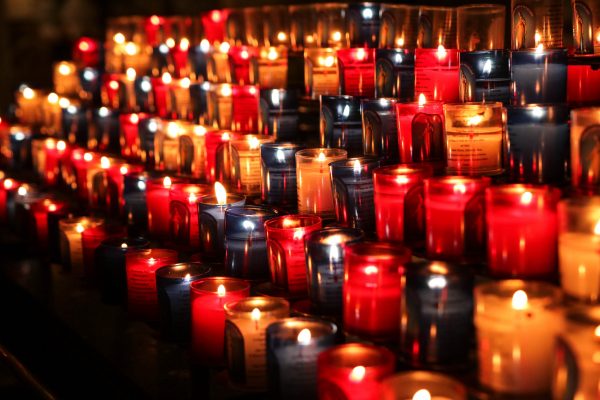 Rows of lit candles.