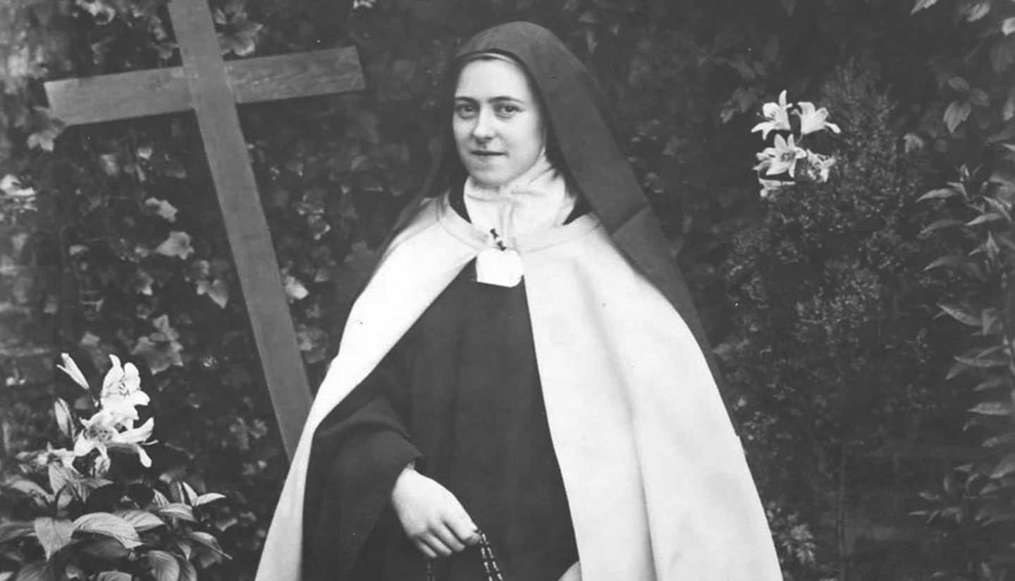 St. Therese, kneeling with rosary