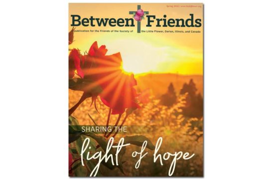 Between Friends Spring 2022 Cover - Beautiful sunrise over a field of grasses and flowers.