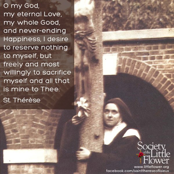 Photo of St. Therese of Lisieux  embracing the large crucifix in the courtyard at Le Carmel monastery.
