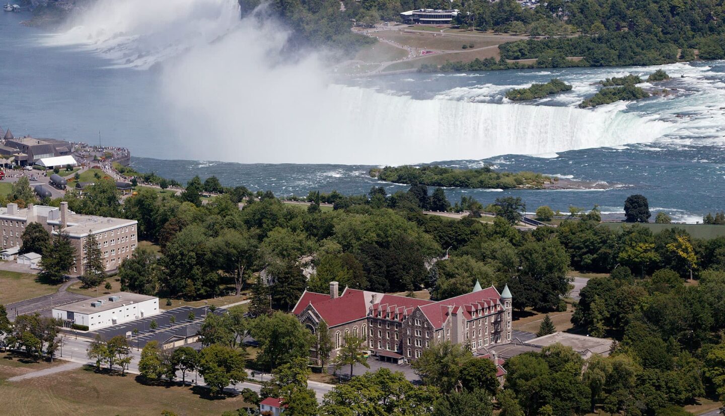 Overhead shot of the Monastery of Mount Carmel with Niagara Falls in the background. Photo credit: Anton Fercher 2007.