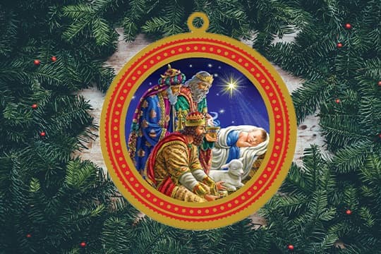 Wisemen offering gifs to Jesus ornament inside Christmas greenery