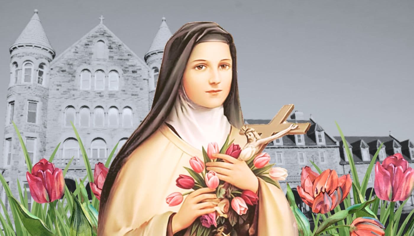 Image of St. Therese with crucifix and tulips in front of monastery